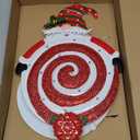 Outdoor solar-powered Christmas yard decoration featuring a red and white glitter spiral lollipop with a Santa figure. Automatically lights up at night. Ground stake installation, no wiring required