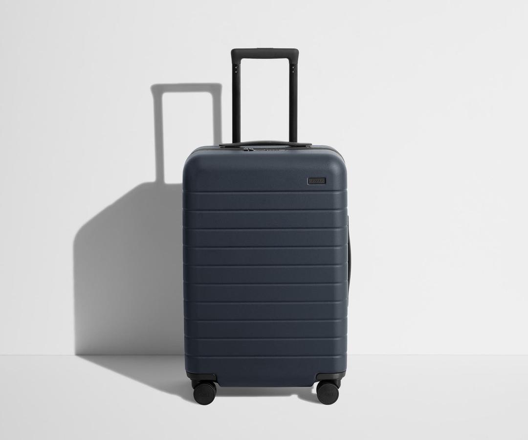 Away Bigger Carry-On Luggage, Lightweight Hardside Large Suitcase with Spinner Wheels, TSA Lock, Airline Approved, Navy Blue