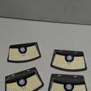 Aootek New Solar Motion Sensor Lights 120 LEDs with Lights Reflector,270 Wide Angle, IP65 Waterproof, Step Lights for Front Door, Yard, Garage, Deck (Black, Daylight White, 4-Pack)