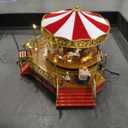 Mr. Christmas Gold Label Animated and Musical Carousel, Christmas Decoration, LED Lights, Plays 50 Songs, 8 Inch, Red