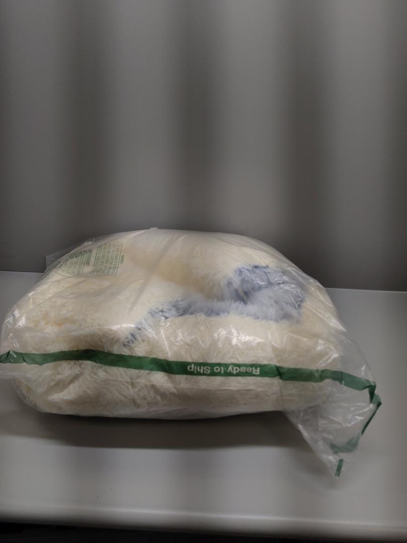 cream fluffy dog bed