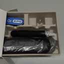 Oral-B iO Series 5 Rechargeable Electric Toothbrush with Visible Pressure Sensor to Protect Gums, 2 Minute Timer, 5 Cleaning Settings, 1 Replacement Toothbrush Heads, and Travel Case, Black