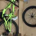 Mongoose Status Mountain Bike, 24 Inch Bike for Kids and Teens, 21 Speed, Aluminum Suspension Frame, Steel Rear Triangle, Suspension Fork, Knobby Mountain Tires, Linear Pull Brakes, For Boys and Girls (Yellow)