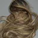 Vomella Dirty Blonde Wig with Bangs 26 Inch Long Curly Wavy Wigs for Women Natural Looking Synthetic Heat Resistant Wig for Daily Party Use