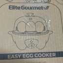 Elite Gourmet EGC-007B# Rapid Egg Cooker, 7 Easy-To-Peel, Hard, Medium, Soft Boiled Eggs, Poacher, Omelet Maker, Auto Shut-Off, Alarm, 16-Recipe Booklet, Black