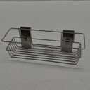 Wall-mounted organizer designed to hold shower essentials like shampoo, body wash, and soap.