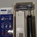 OralB Rechargeable Electric Toothbrush, iO2 Starter Kit, 3 Cleaning Modes, Automatic Pressure Sensor to Protect Gums, 2 Brush Heads, Night Black