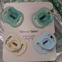 Tommee Tippee Ultra-Light Stay Put Pacifier, One-Piece Silicone Design, 0-6m, 4 Pack (Cream/Yellow/Blue/Sage)