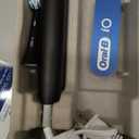 Oral-B iO Series 2 Rechargeable Electric Powered Toothbrush Starter Kit, Night Black with 2 Brush Heads - Automatic Pressure Sensor to Protect Gums - 3 Modes - 2 Min Timer