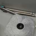 True & Tidy True Clean Spin Mop & Bucket System  Dual Compartment Design for Clean & Dirty Water, 360 Swivel Mop Head, Built-in Scrubbing Brush, Stainless Steel Handle & 2 Reusable Microfiber Pads