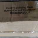 HUANUO Electric Standing Desk, 63 x 24 Inch Height Adjustable Computer Desk with Storage Bag, 4 Height Memory Settings, Sit Stand Up Desk for Home Office, White