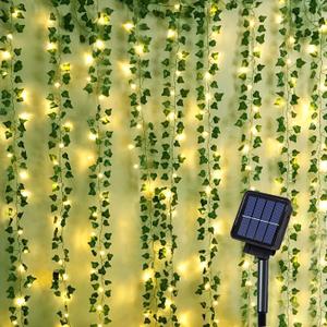 ANGMLN Solar Vine String Lights, 66Ft 200 Led Outdoor Fairy Lights with Ivy, 8 Modes Waterproof Artificial Plant Leaf Garland for Balcony Patio Wedding Garden Yard Fence Wall Apartment Outside Decor