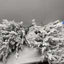 Puleo International 4.5ft Pre-Lit Potted Flocked Arctic Fir Christmas Tree with 70 Clear Lights, 419 Realistic Dense Snow Flocked Branch Tips, Easy Setup Artificial Trees with Sturdy Stand