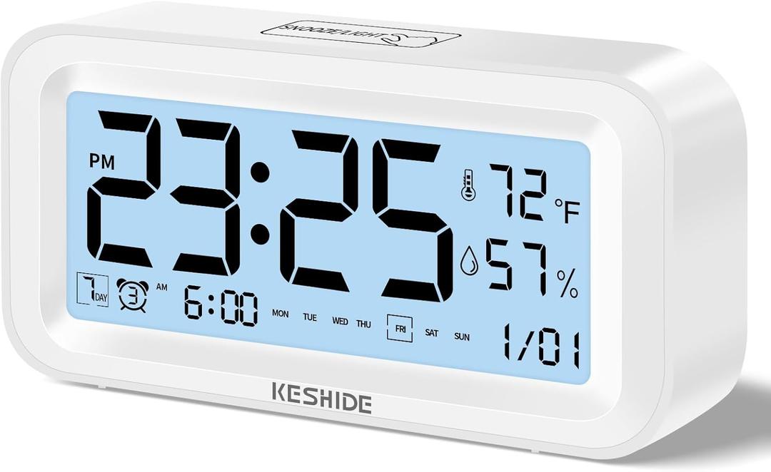 KESHIDE Night Light Digital Alarm Clock Battery Operated with Indoor Temperature Humidity, Desk Small Clock,Snooze Model,12/24H Display for Bedrooms Heavy Sleepers Kids Travel Bathroom (White)