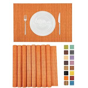 ANDSTAR Non-Slip Waterproof Placemats Set of 8 - Reusable Wipeable Table Mats for Dining Table, Kitchen, Outdoor Picnic, 12x18 Inch PVC Backed Heat Resistant Place Mats Dishwasher Safe（Orange）