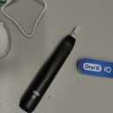 Oral-B Rechargeable Electric Toothbrush, iO2 Starter Kit, 3 Cleaning Modes, Automatic Pressure Sensor to Protect Gums, 2 Brush Heads, Night Black
