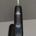 Philips Sonicare ProtectiveClean 5300 Rechargeable Electric Toothbrush, with Pressure Sensor, 3 Cleaning Modes, SmarTimer and QuadPacer, with 2 Bonus Brush Heads, Travel Case, Black, Model HX6423/34