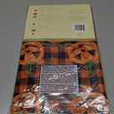 Newbridge Halloween Jack-O-Lantern Vinyl Tablecloth with Flannel Backing, 70 Inch Round, Orange and Black Buffalo Plaid with Spooky Pumpkin Faces, Wipe Clean Halloween Table Cover