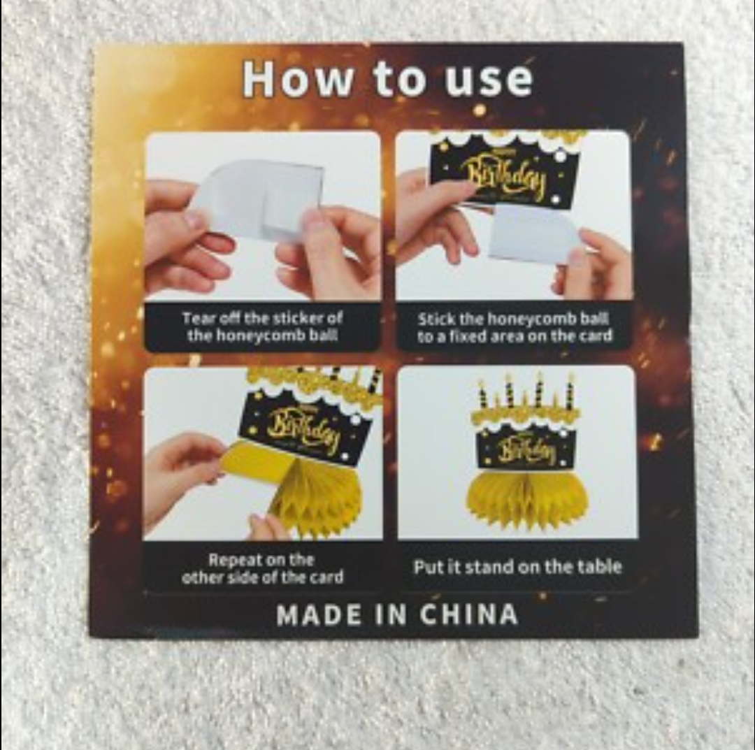 The image displays a package for honeycomb table centerpieces, specifically a "Graduation Centerpiece 10 Pcs (Orange)". The package also includes instructions on how to assemble these decorations, which are commonly used for parties and events. 
How