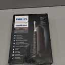 Philips Sonicare ProtectiveClean 5300 Rechargeable Electric Toothbrush, with Pressure Sensor, 3 Cleaning Modes, SmarTimer and QuadPacer, with 2 Bonus Brush Heads, Travel Case, Black, Model HX6423/34