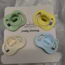 Tommee Tippee Ultra-Light StayPut Pacifier, One-Piece Silicone Design, 0-6m, 4 Pack (Cream/Yellow/Blue/Sage)
