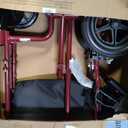 Medline Lightweight Foldable Transport Wheelchair with Handbrakes and 12-Inch Wheels, Red Frame, Black Upholstery