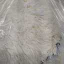 cream fluffy dog bed