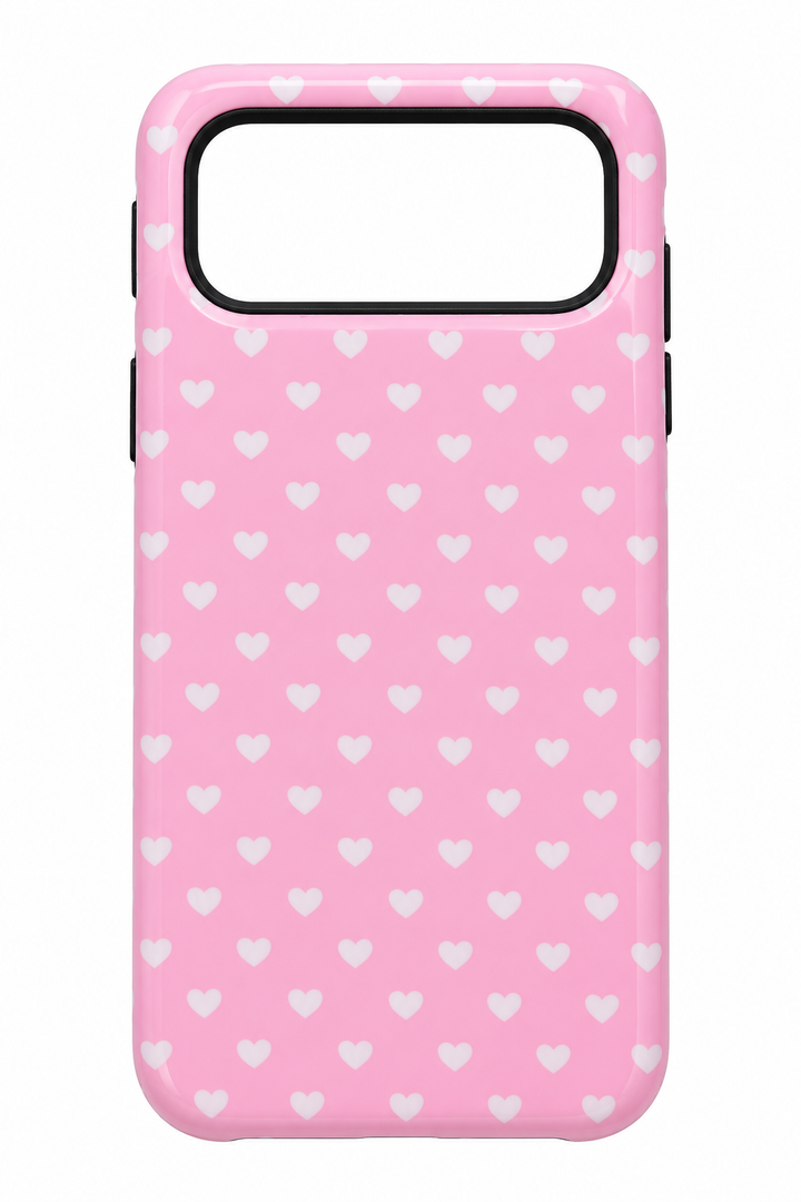 Pink Phone Case with White Heart Pattern and Black Camera Cutout.