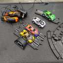 Car 
2-in-1 Slot Car Race Track Set with 4 High-Speed Cars, Electric Track, Dual Racing Game with 2 Controllers, Circular Overpass Design Featuring Flash Tracks. Toy Gift for Boys Kids Ages 4-6 6-8 8-12