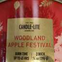 Candle-lite 14 oz jar candle features a Woodland Apple Festival scent.