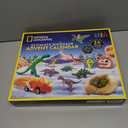 NATIONAL GEOGRAPHIC 2026 Dinosaur Advent Calendar - Countdown Calendar with 24 Dino Activities & Figures, Paint A Dinosaur Racer, Create a Clay T. Rex, Excavate a Dino Tooth Replica & More