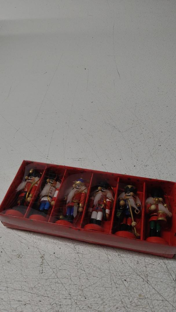 Christmas Plastic Nutcracker Soldiers Set of 6 - 9". Celebrate Christmas Nutcracker. Each Nutcracker Soldier Holds Something Different Assorted Among Club, Horn, Scepter, Sword, Ax & Gun