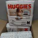 Huggies Size Newborn Diapers, Skin Essentials Baby Diapers, Size Newborn (6-9 lbs), 180 Count (3 Packs of 60)