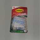 Command Outdoor Light 4 Pack of 16 Clear Clips and 20 Strips, Damage Free Hanging with Adhesive Strips, Wall Clips for Hanging Outdoor Lights and Cables Outside