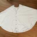 white scarf with buttons, no sleeves 