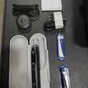 Oral-B iO Deep Clean + Protect Rechargeable Electric Toothbrush, Black, iO Series 7, 2 Replacement Brush Heads, Charging Travel Case