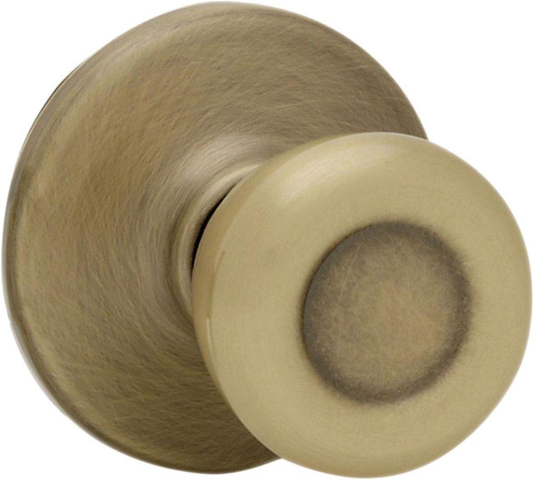 Kwikset Tylo Interior Passage Door Knob, Handle For Closet and Hallway Doors, Non-Locking Doorknob in Antique Brass, with Microban Protection
