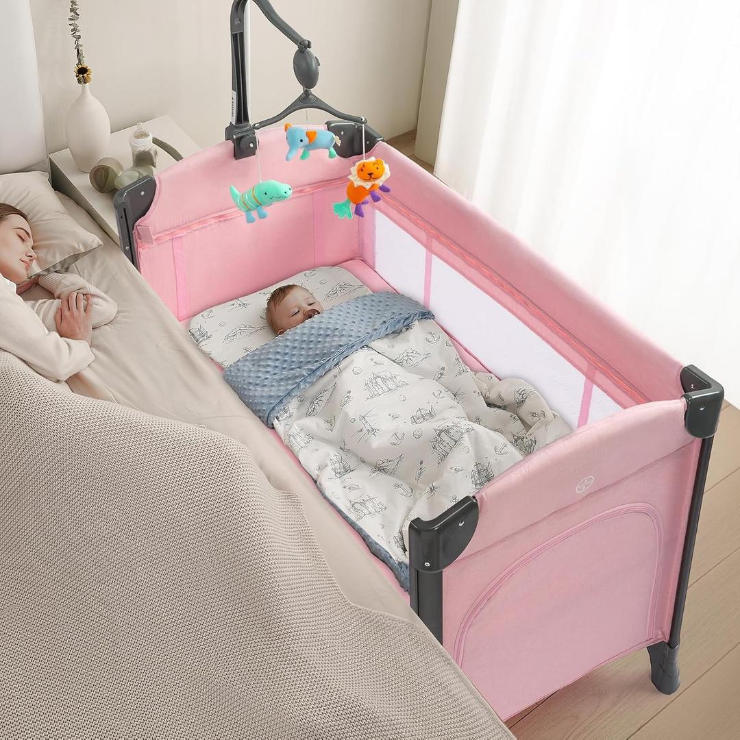 JOYMOR Baby Bedside Bassinet, Baby Bassinet, Pack n Play Convert Playpen, Quick Foldable Travel Bed, Wheels & Brake, Carry Bag for Boys Girls (Pink)