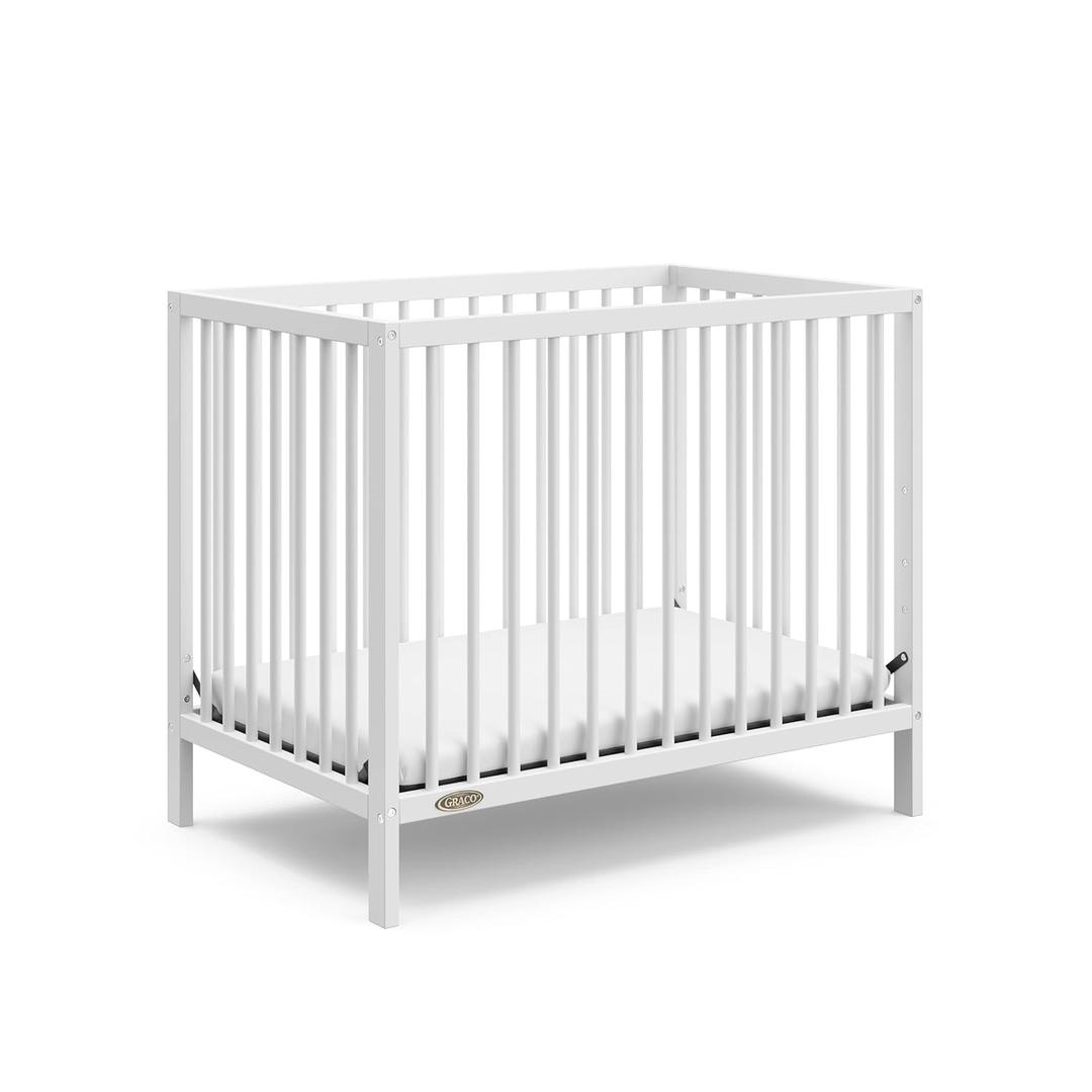 Graco Teddi 4-in-1 Convertible Mini Crib with Bonus Water-Resistant Mattress GREENGUARD Gold Certified, 2.75-Inch Mattress Included, Small Spaces Crib, Easy 30-Minute Assembly (White)
