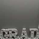 Graduation Decorations 2026, 4 LED Light Up Letters GRAD Sign for Class of 2026, Battery Operated Marquee Letter Lights GRAD Sign for High School Senior College Graduation Party Supplies- Warm White