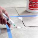 The Original Fix-A-Floor Loose Tile Repair Adhesive - Tile, Marble, Stone, Wood - Easy DIY Repair – Versatile Compatibility - 1 Gallon Jug – Comes with a Syringe Applicator