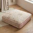cushioned floor pillow featuring a beautifully textured beige jacquard weave