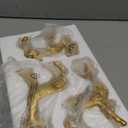 Lulu Home 3 PCS Christmas Tabletop Decorations, Resin Golden Reindeer Family Figurines with Diverse Postures, Xmas Holiday Winter Centerpieces Ornaments for Mantel Shelf Sill Decor (Peer (Textured))