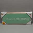 Decorative Wooden Wall Sign Featuring A Mint-Green Background And Bold White “It’s A Shore Thing” Lettering. Lightweight, Coastal-Themed Décor Perfect For Entryways, Living Rooms, Or Beach-Style Interiors