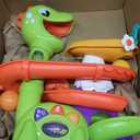 Move2Play, Air-Powered Dinosaur Ball Popper | 30+ Songs, Sayings, & Lights | Baby & Toddler Toys Ages 6 7 8 9 10 12+ Months | Boy & Girl Gift for 1, 2+ Year Olds | Birthday Present