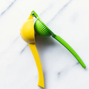 Lime Squeezer with Grip Handle in Vibrant Green by Home Basics | Quick and Easy Citrus Juice Extraction with Built-In Strainer for No-Mess Operation