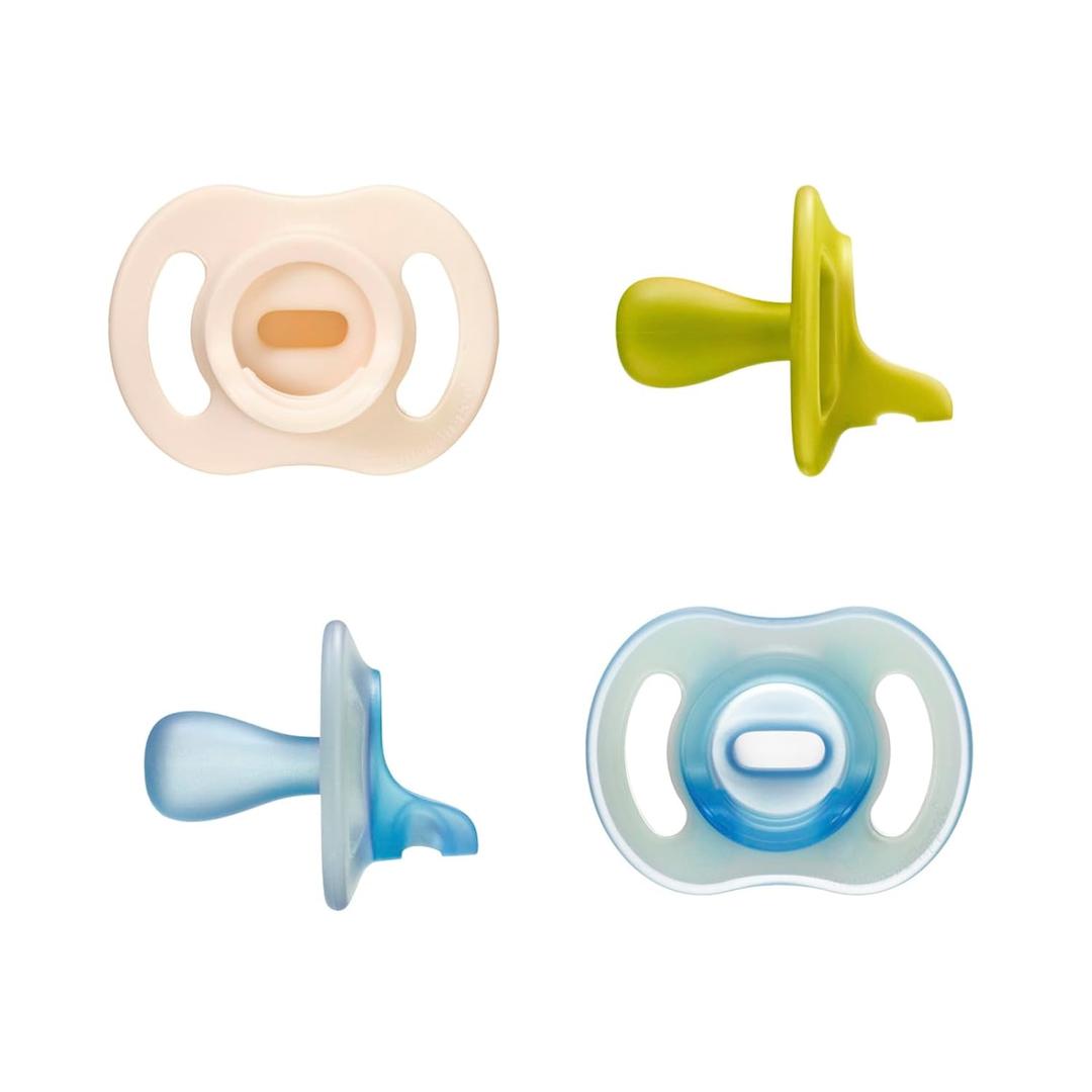 Tommee Tippee Stay Put Pacifier Set, Contains 2 Ultra-Light StayPut Glow in the Dark Pacifiers and 2 Ultra-Light StayPut Pacifiers, 6-18 Months, Colors May Vary, One-Piece Silicone Design, Pack of 4
