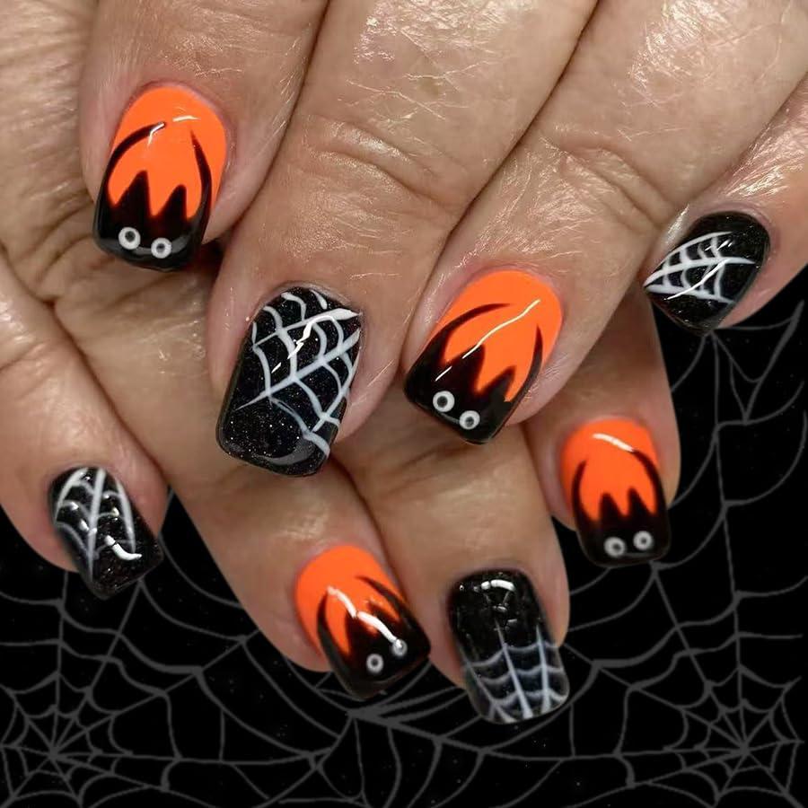 24Pcs Short Press on Nail Halloween Cute Bat Fake Nails Orange Square Stick on Nails Cobweb Glitter False Nails for Women Full Cover Halloween Glue on Nail