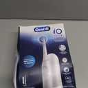 Oral-B Rechargeable Electric Toothbrush, iO Limited Simple Clean, 3 Cleaning Modes, Automatic Pressure Sensor to Protect Gums, Travel Case, White
