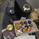 Nespresso Festive Vertuo Pop+ Coffee and Espresso Maker by Breville, Matte Black Gold. BBD 31/03/2026